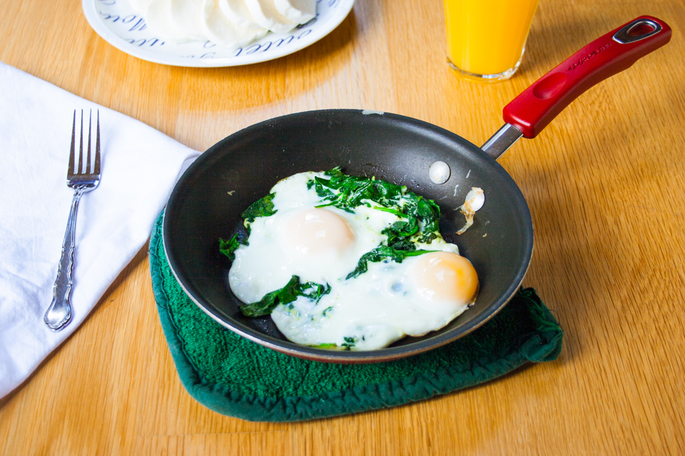 Handful of Spinach and Eggs Over Easy - Improv Oven
